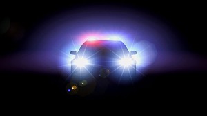 police-car-with-headlights-on_100391256_m