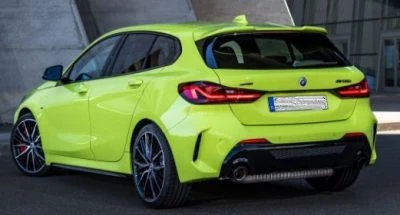 Rear view of the 2024 BMW 1 Series hatchback in fluorescent yellow