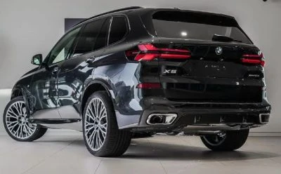 Rear view of the BMW X5 Petrol SUV in glossy black 