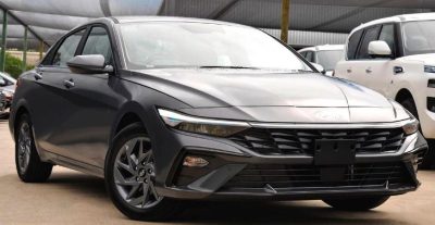 2024 Hyundai i30 Hybrid Sedan in black, front and side