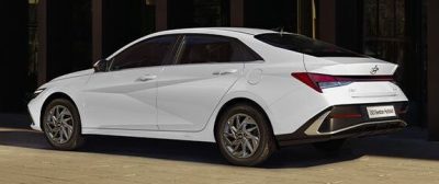 2024 Hyundai i30 Hybrid Sedan side and rear in white